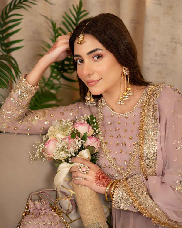 Dusty Pink Suit with Gold Detailing & Matching Potli