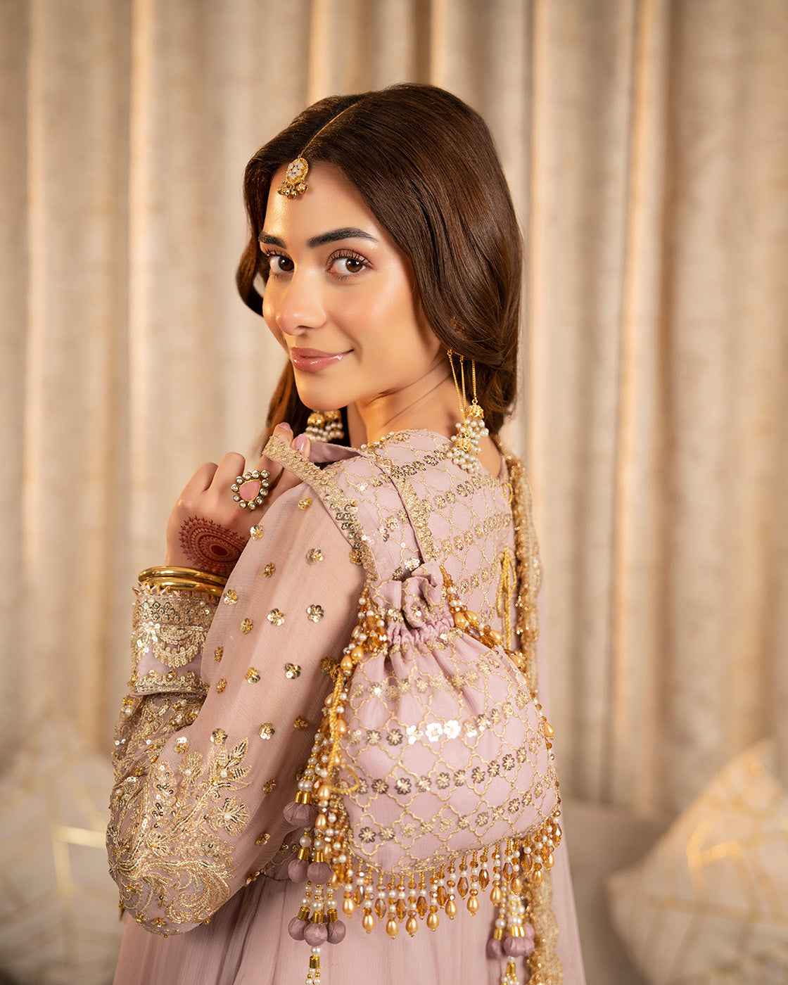Dusty Pink Suit with Gold Detailing & Matching Potli